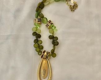 $26  Peridot color necklace with gold tone tear drop pendant Chico's.  21"L