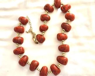 $28 Red orange beaded necklace.  27"L 