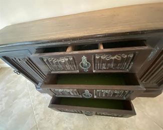 Drawers of buffet table. Top drawer has dividers.
