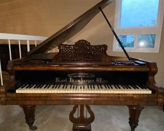 Antique piano.  Walnut, late Victorian. Serial #2884. Plays but soundboard is off. Karl Hamburger. Ivory keys a little discolored.