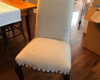 (2) Pottery Barn upholstered armless chairs in neutral fabric 