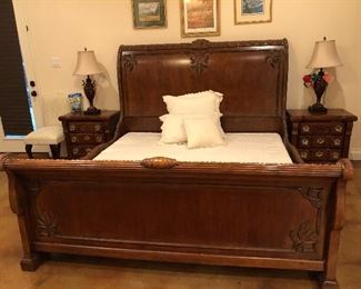 King side designer bed with matching nightstands and decor