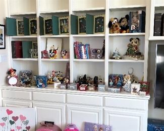 LOTS of Disney collectibles, including figurines, stuffed animals (some vintage), statuary, kid's items, books,  new in box ornament sets, snow and water globes, bookends, etc. 
