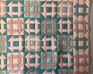 Hand quilted churn dasher quilt 