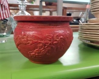 red relief carved vessel