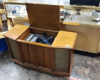 vintage turntable in media cabinet