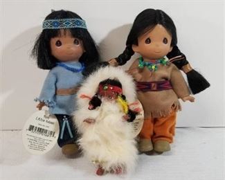 Two Precious Moments Native American Dolls. One Alberta Game Farm Doll.