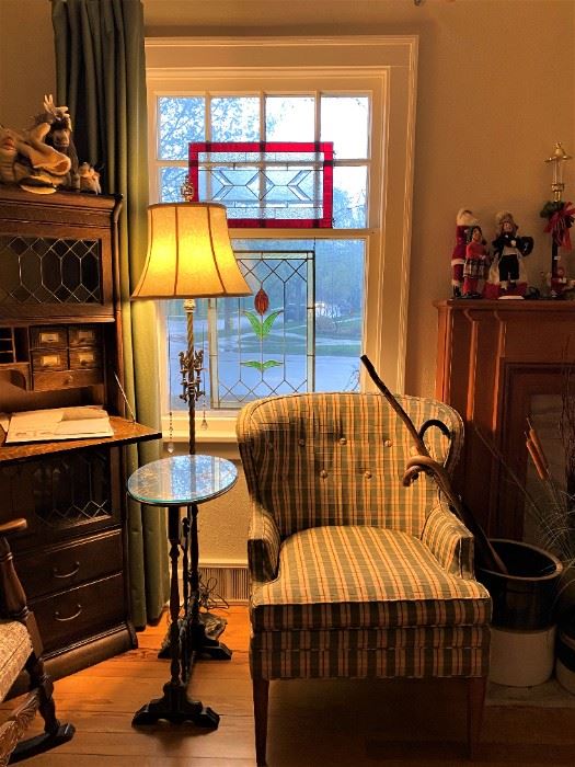 Fine upholstered sitting chair, marble base lamp with dual lights, leaded hanging glass window panels and early 1900 leaded glass secretary. 