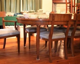 Mid Century Modern Table with 4 leaves and 6 chairs newly upholstered in cowhide