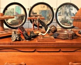 Pipe holders, vintage ashtrays, nautical mirror