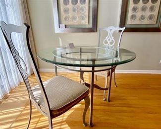 Lot 7528. $795.00. Johnston Casuals Princeton 42" Round Beveled Glass Table with silver color metal base, 2 Princeton upholstered Dining chairs  19" W  x 41" H  x  21" D.  (On Sale at $1,940.00,  Chairs are $490.00 Ea and Table is $960.00). Made by Johnston Casuals Furniture Inc WIlkensboro, NC.