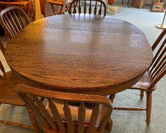 Solid oak table and chairs with leaves 