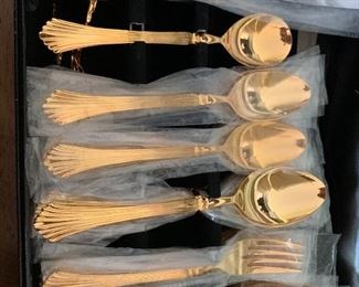 Golden Cannes Gold Flatware. 8 place settings plus hostess serving set $75 set. ( in wrappers in box)