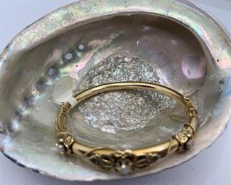 Item #30 view 1  Vintage 14 K Gold Bangle with 3 opals. It measures 2.5" by 2.5" with about an 8 inch circumference. $500