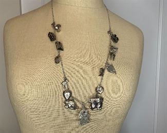 Item #43 29" Charm Necklace with  16 Sterling Charms  $95 ( I do not believe the chain is sterling)