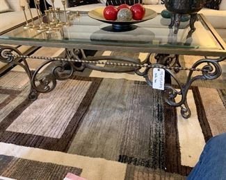 19" by 50" by 30" Ornate Metal Coffee Table with Glass Top  $150