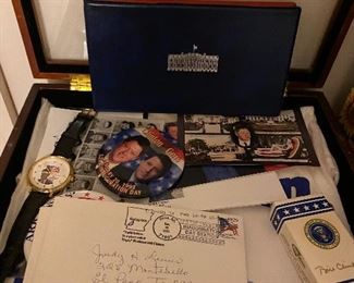 Clinton items in display case (watch, shirt, pins)  $60