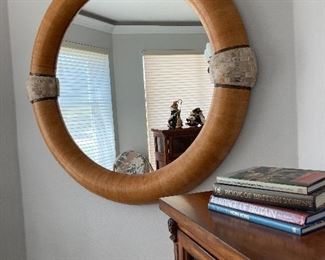 HUGE MIRROR: Frame— white anaconda snakeskin with coral and brass. Diameter: 48 inches.  $850.
