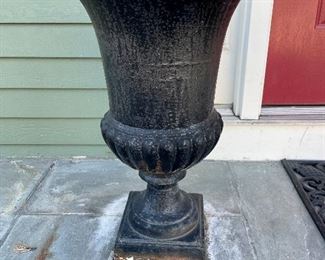 Pair of cast iron urns 
