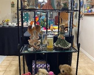 Metal Baker's rack. with religious figurines and stuffed animals