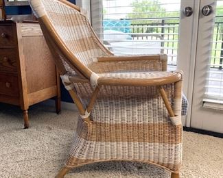 Striped wicker chair with houndstooth seat cushion measures 34" x 30" x 40"