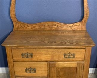 Antique washstand with harp towel bar measures 32" x 16" x 25.5" Overall height is 46"