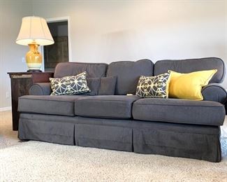 Vintage Baker traditional sofa newly reupholstered in charcoal grey ribbed fabric. Measures 84" long and 38" deep