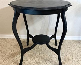 Black painted occasional table measures 26" in diameter and 28" high.