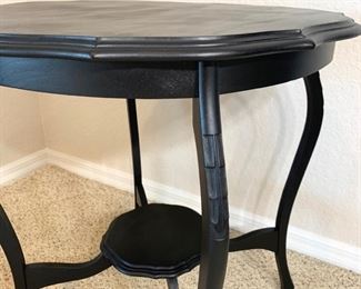 Black painted occasional table measures 26" in diameter and 28" high.