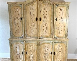 Hand painted distressed 2PC imported cabinet. Bottom piece measures 72" wide and 36.5" high. Top piece measures 69" wide and 51" high. Overall height measures 87.5"