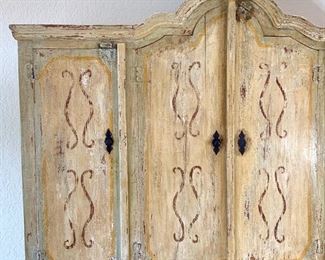 Hand painted distressed 2PC imported cabinet. Bottom piece measures 72" wide and 36.5" high. Top piece measures 69" wide and 51" high. Overall height measures 87.5"