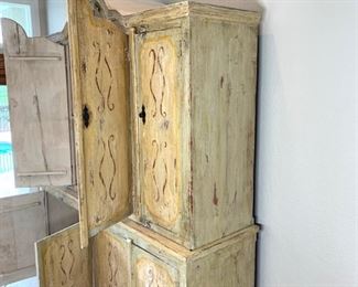 Hand painted distressed 2PC imported cabinet. Bottom piece measures 72" wide and 36.5" high. Top piece measures 69" wide and 51" high. Overall height measures 87.5"