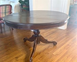 Round pedestal table measures 46" in diameter and 30" high