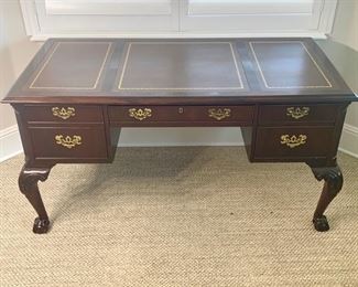 Hekman Leather top desk measures 58" x 29". The desk is finished on the back as shown in photos.