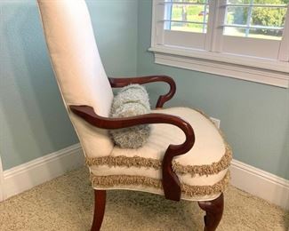 Arm chair with fringe detail measures 26" x 25" x 42" (some stains on seat of chair)