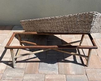 Wicker trough coffee table measures 48" x 20" x 17" Wicker trough sits on top of wood base as shown in photos.