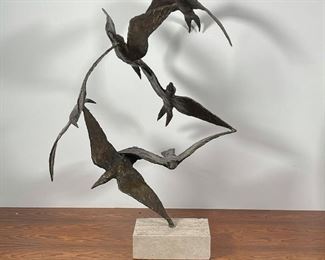 BIRDS IN FLIGHT BRONZE SCULPTURE | six interconnected birds in flight, mounted on a travertine base; h. 27 x 20 x 18 in. 