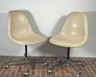 PAIR HERMAN MILLER OFFICE CHAIRS | both in off-white leather, appear in good condition but need to be cleaned/ conditioned 