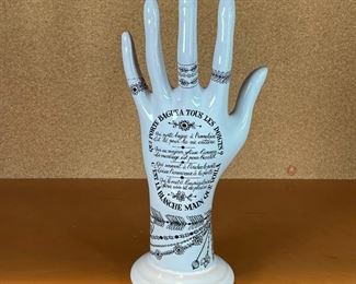 PAINTED PORCELAIN HAND | Made in france, French writing and drawn decoration, pinky broken but present; h. 10 in. 