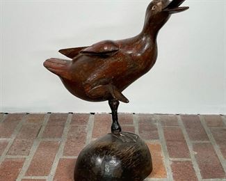 CARVED WOODEN DUCK | with one leg raised and mouth open; h. 16 in.