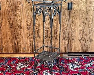 WROUGHT IRON STAND | finely sculpted iron scrollwork, parts bound with brass, punchwork shelves; h. 38 x 13 x 13 in. 