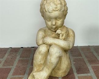 HEN FEATHERS COMPOSITION SCULPTURE | depicting a boy holding a bird; h. 13 in. 