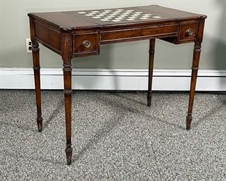 OLD COLONY PAINTED GAMES TABLE | the top with a hand painted chessboard on a sliding mechanism that reveals an interior backgammon board over two drawers; h. 29 x 36 x 20 in.