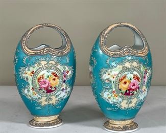 PAIR JEWELLED PORCELAIN BASKET VASES | each handpainted with floral reserves and raised enamel decorations; h. 8-1/2 x 5 in.