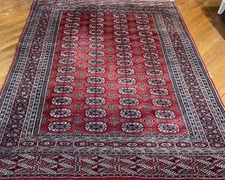 BOKHARA RUG | guls in a red field; 9ft x 5ft-10in.