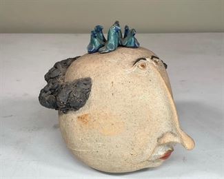 SANSONE ART CERAMIC | possibly Vincent Sansone; figure of a man's head with glazed bluebirds; h. 6 x 6 x 7 in.