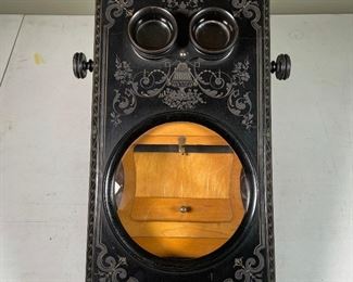 IMPORTANT EARLY STEREOSCOPIC VIEWER | with a large lens viewer under two looking glass eyepieces, ornately carved wooden box; h. 6 x 11 x 16 in.