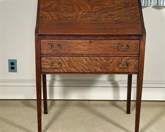 EARLY OAK SECRETARY DESK | having a fall-front over two full width drawers; h. 38 x 28 x 16-1/2 in.