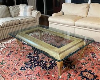 GLASS & CARVED WOOD COFFEE TABLE | rectangular glass top on a carved wooden base with cabriole legs; h.16 x 6 x 36 in.