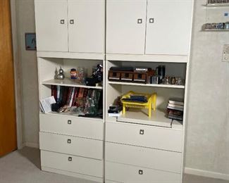 PAIR CONTEMPORARY CABINETS | off-white laminate with ring pulls, one with a slide-out tv stand; h. 77 x 30 x 19 in. (each)
